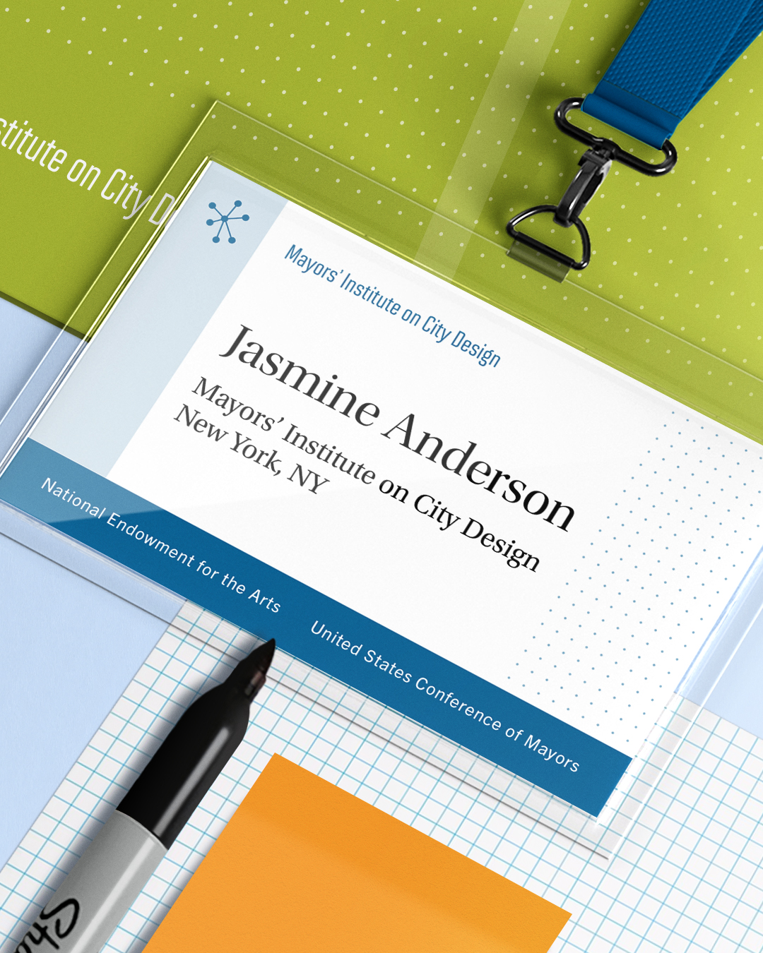 Name tag with dark blue lanyard.