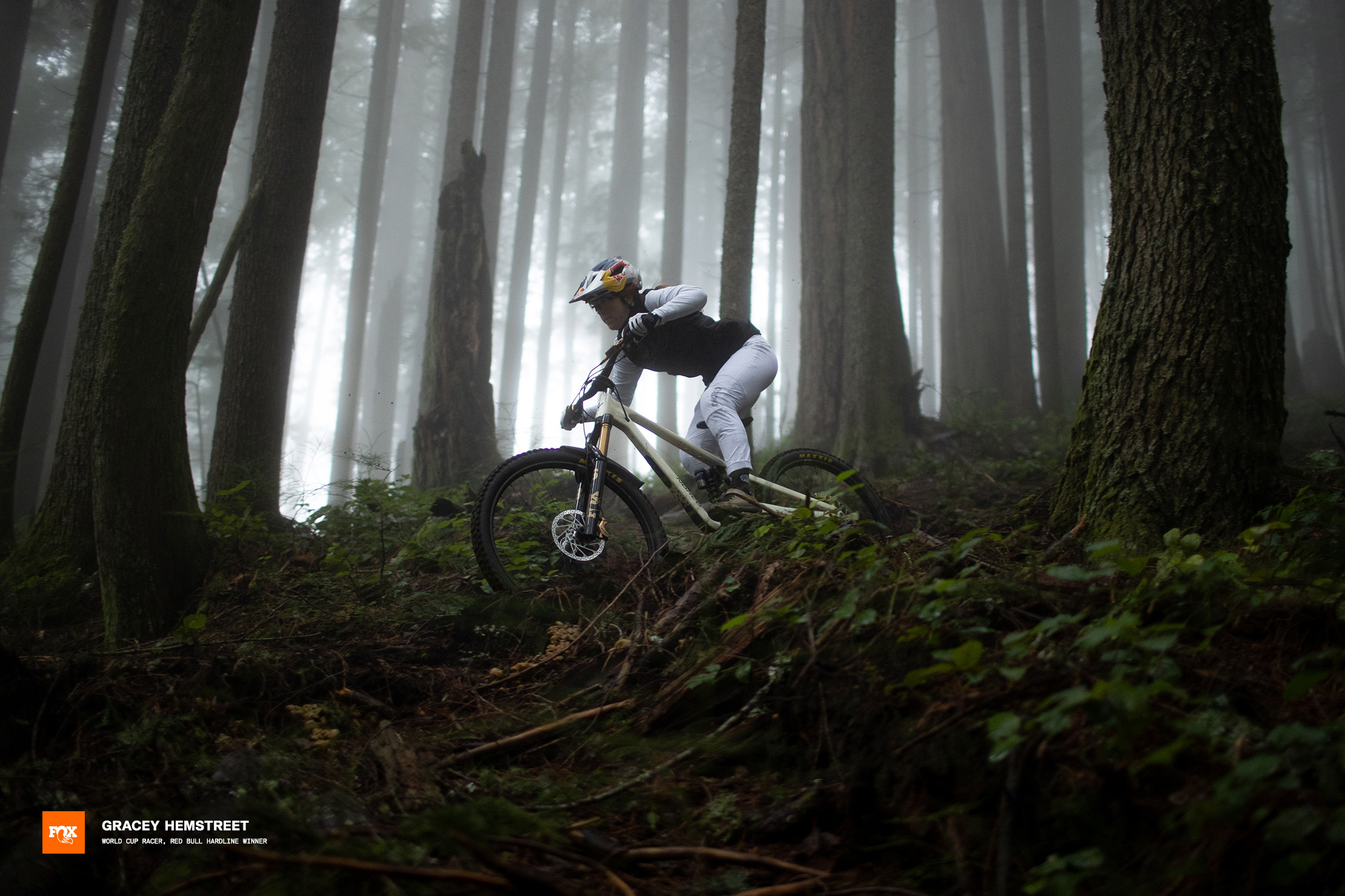 Pro rider Gracey Hemstreet shredding a foggy trail in British Columbia.